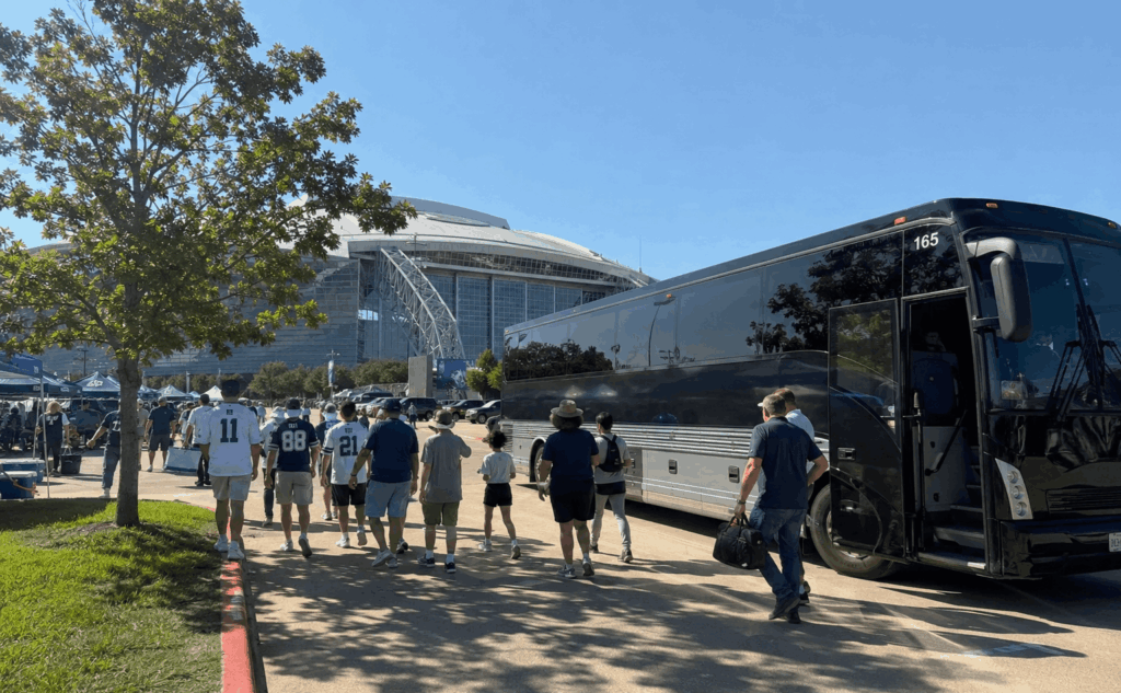 charter bus dropping off cowboys fans near at&t stadium in arlington before a dallas cowboys game