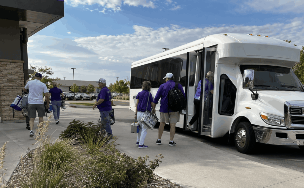 small group boarding a game day shuttle at an abilene hotel before an acu wildcat football saturday