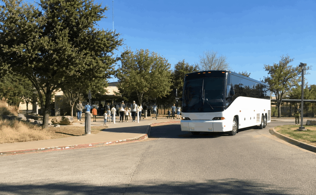 charter bus staged along the nelson park loop road near the abilene zoo entrance