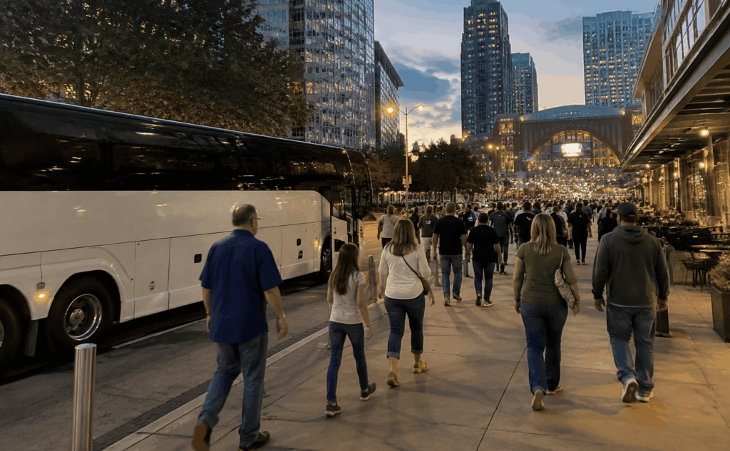 charter bus dropping off an abilene group near american airlines center in dallas for a mavericks or stars game night