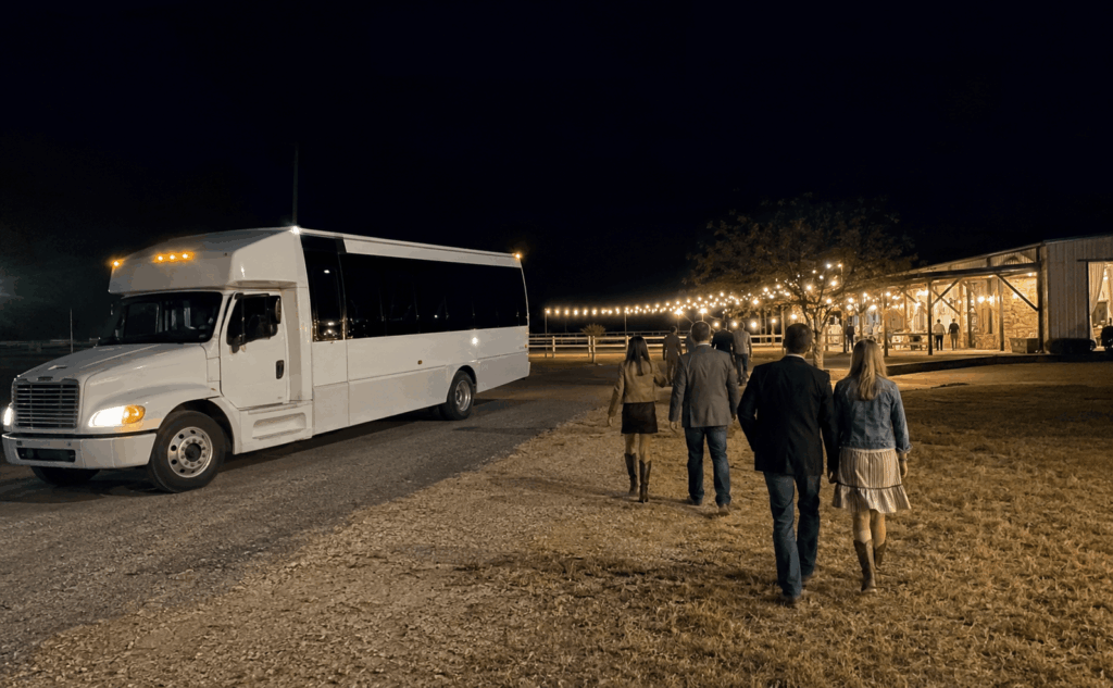 charter bus waiting outside a ranch-style wedding reception near buffalo gap for late-night guest return transportation