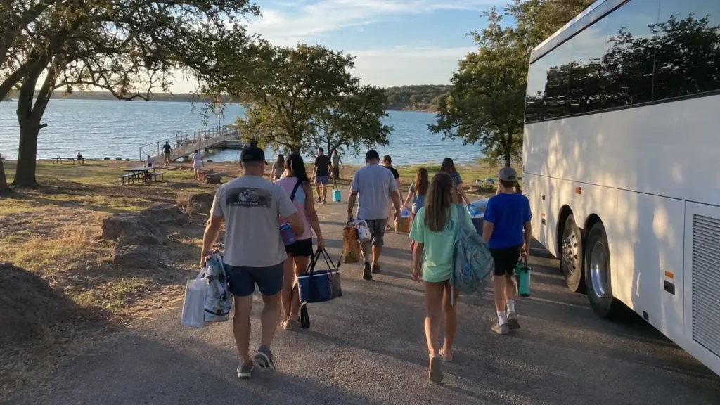 church retreat group arriving by charter bus at lake brownwood state park from abilene