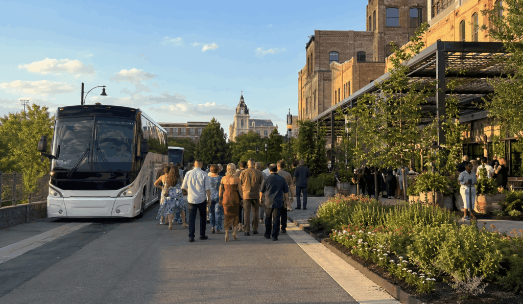 charter bus parked near the pearl district while a group explores san antonio during a weekend trip