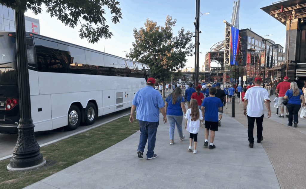 charter bus dropping off a group near texas live before a rangers game in arlington